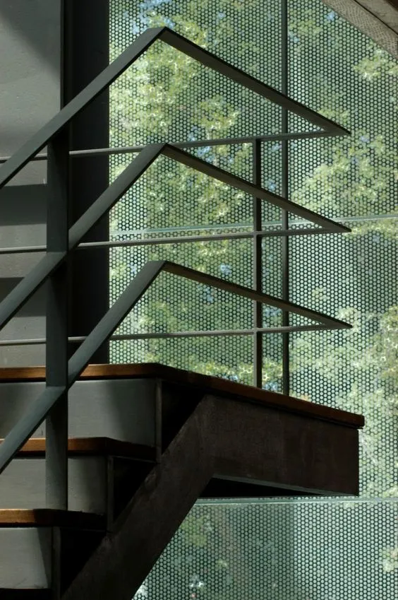 Modern steel handrail on a staircase by MetalX